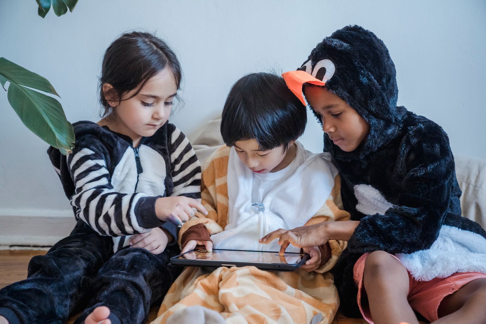 Children playing a game on a tablet